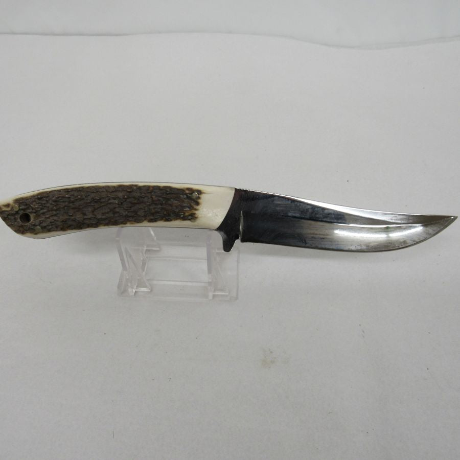 Used vintage curved trailing-point fixed-blade skinning knife