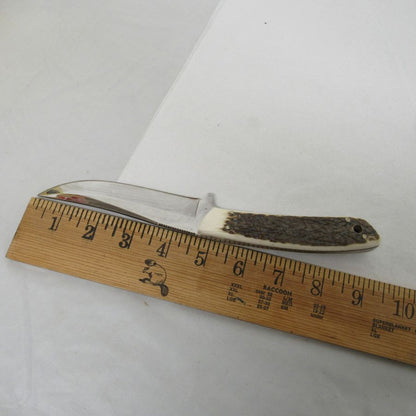 Used vintage curved trailing-point fixed-blade skinning knife